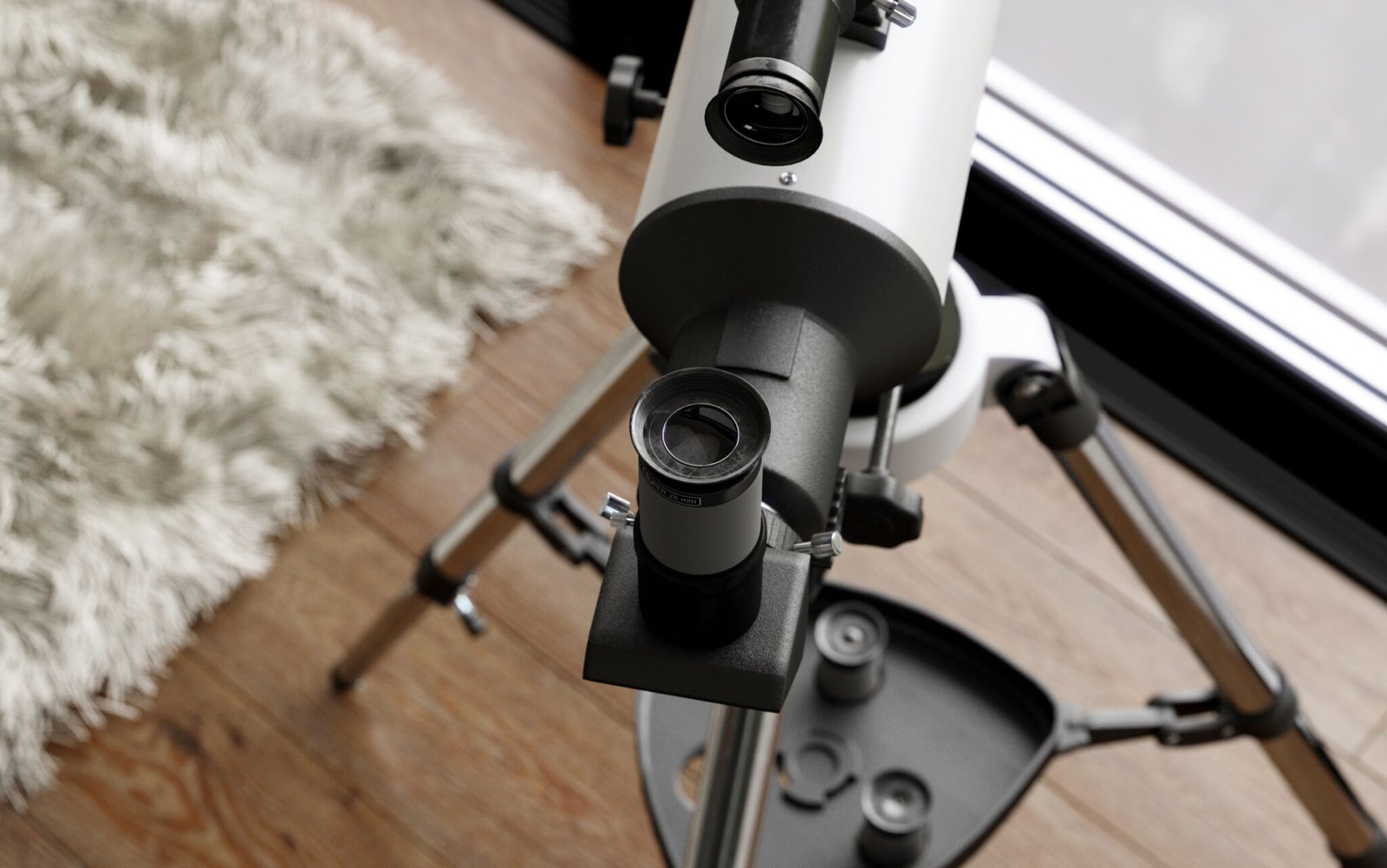 Close-up of a professional telescope mounted on a stand, placed indoors on a wooden floor